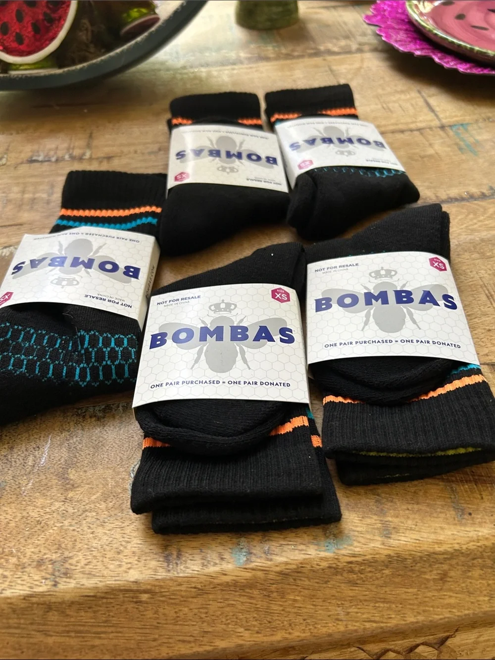 Bombas Black Crew Socks with Orange, Blue, and Yellow Accents for Children